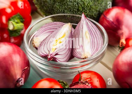 sliced red onion on wood background Stock Photo