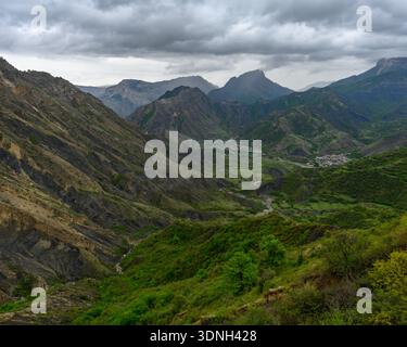 Panoramic landscape with valley under cloudy sky on a rainy sunny ...