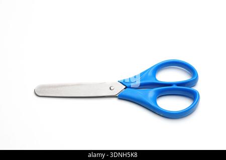 Blue baby scissors on an isolated white background/Blue baby scissors on an isolated white background Stock Photo