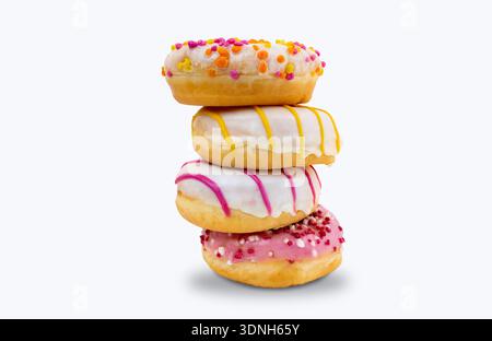 Delicious dessert. Pink, white and chocolate donuts with multicolored sprinkles on a white background of Sweets. Confectionery products. Stock Photo