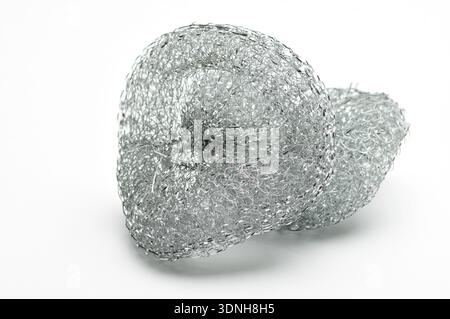 Metallic sponge for washing dishes and plumbing on isolated white background Stock Photo