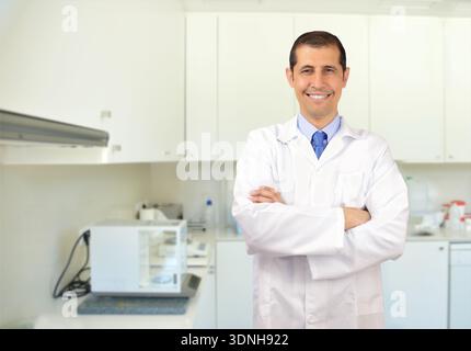 Cropped portrait of an handsome young male scientist working in her lab Stock Photo