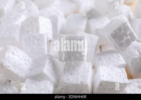 Pile of styrofoam cubes as background, closeup Stock Photo