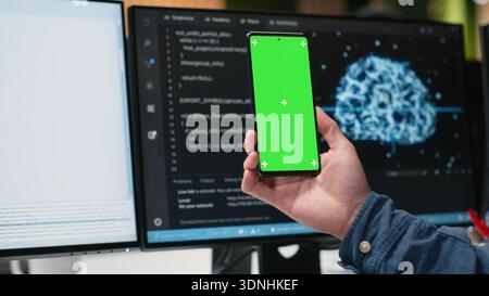 Isolated screen mobile phone used by admin in company workplace doing tech quality assurance. IT worker in office watches tutorial on programming languages with mockup smartphone, close up Stock Photo