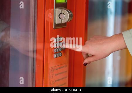 Hand Pressing Buttons On Vending Machine Control Panel Close Up Stock Photo