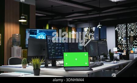 Isolated screen laptop used in company workplace for artificial intelligence tech quality assurance. Mockup notebook in empty office used to write AI script with programming languages Stock Photo