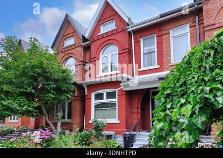 Row of old fashioned semi-detached houses with gables Stock Photo