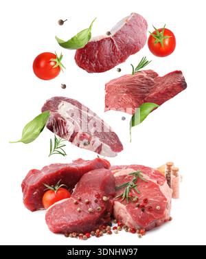 Fresh beef steaks falling on white background Stock Photo
