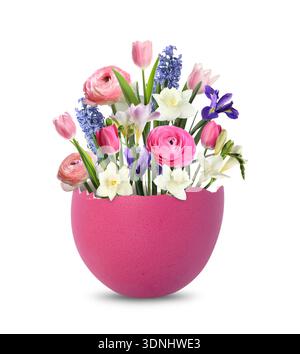 Cracked Easter eggshell with spring flowers on white background Stock Photo