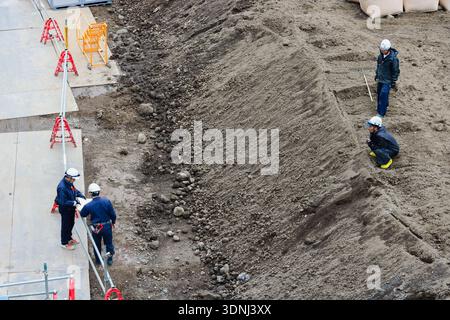 TOKYO, JAPAN - January 17, 2020: Workers on the construction site of Shibuya Sakura Stage in Shibuya. Stock Photo