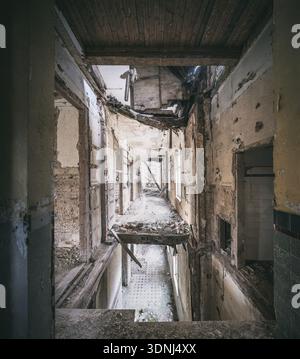 Long corridors and collapsed ceilings in a former sanatorium, Lost Place, Saxony-Anhalt, Germany Stock Photo