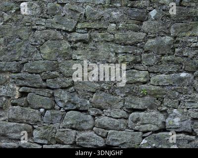 Weathered Grey Black Limestone Stone Wall Texture Background Stock Photo