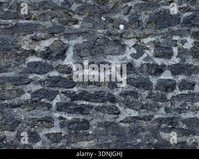 Historic Limestone with Natural Black Staining Stock Photo