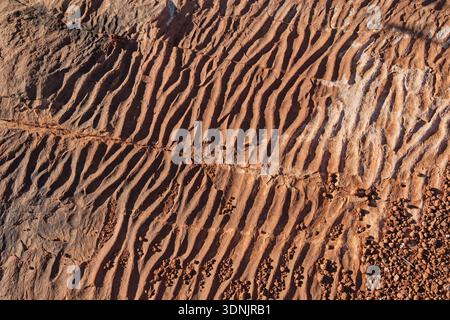 ancient sand ripples in a red rock sandstone layer Stock Photo