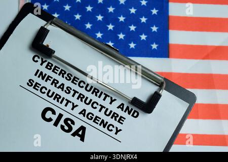 Concept of CSIA - Cybersecurity and Infrastructure Security agency write on clipboard isolated on Wooden Table. Showing government cyber defense and c Stock Photo