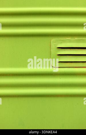 Lime Green Corrugated Metal with Vent Detail Stock Photo