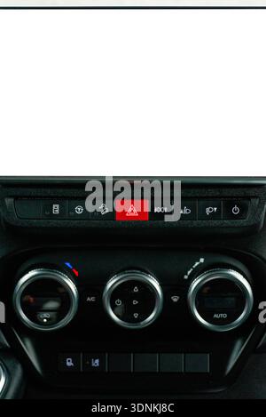 Close up of a car center console showing a vertical white screen mockup above manual air conditioning dials. Stock Photo