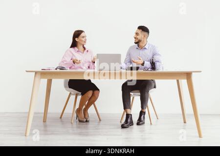 Business Meeting Between Two People in Office Setting During Daytime Stock Photo