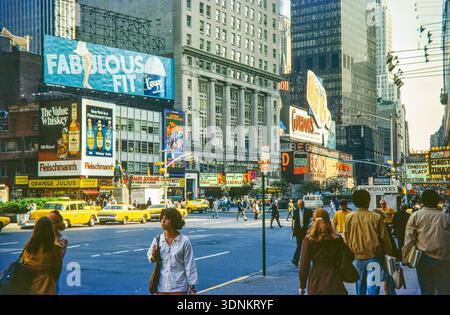 Advertising billboards yellow taxi cabs, crowded streets, Times Square, Broadway and West 43rd Street, Broadway, Manhattan, New York City, USA 1976 Stock Photo