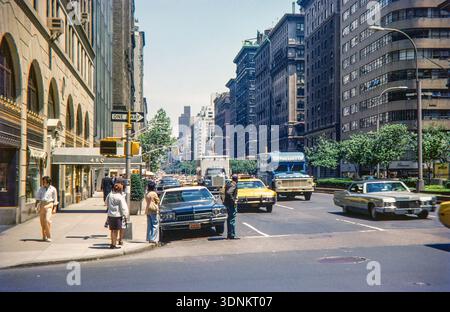 Traffic at the corner of 5th Avenue and 48th Street looking south, Midtown Manhattan, New York City, USA 1976 Stock Photo
