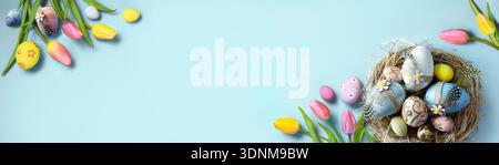 Easter Eggs In A Bird Wicker Nest - Yellow And Pink Tulips Flowers - Spring Season Banner Stock Photo