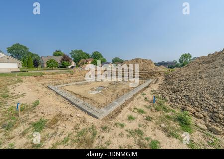 new construction has foundation walls poured in a residential home construction project Stock Photo
