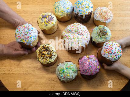 variety of homemade Easter baked goods, decorated with traditional Easter sprinkles. View from above. Ukrainian traditions for preparing for the holid Stock Photo