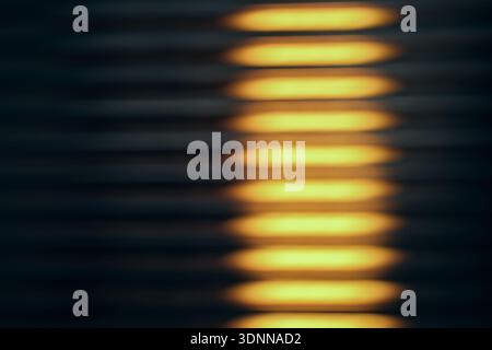 Warm glowing light through fluted glass, minimal abstract texture background Stock Photo