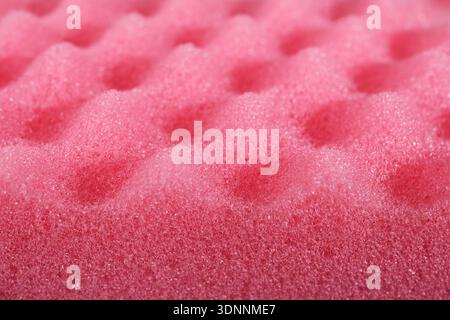 Pink acoustic foam showing soft and absorbent bubbly texture Stock Photo