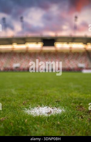 Point of penalty spot painted on the grass at the football stadium. Stock Photo