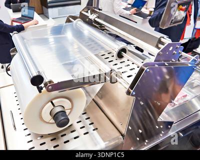 Industrial machine for packing plastic boxes in food production Stock Photo