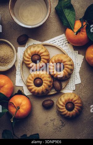 Mini bundt cakes with chocolate eggs Stock Photo