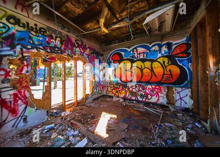 Graffiti Art and Urban Decay Inside Abandoned Lake Dolores Water Park California Stock Photo