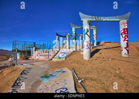 Graffiti Covered Concrete Columns and Ruins at Abandoned Water Park in California Stock Photo