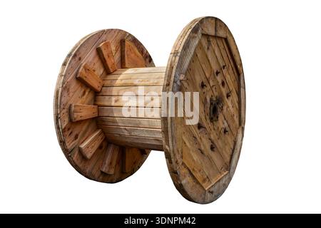 wooden smooth large coil for winding high-voltage wire or cable. yellow wooden coil, wire winding. tool for electricity. construction site.The problem Stock Photo