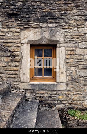 Old Stone Building with Medieval Door and Window in France Stock Photo