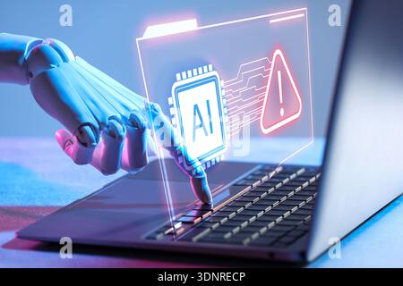 Robot using laptop, virtual screen above computer showing AI microchip and warning sign. Artificial intelligence safety Stock Photo