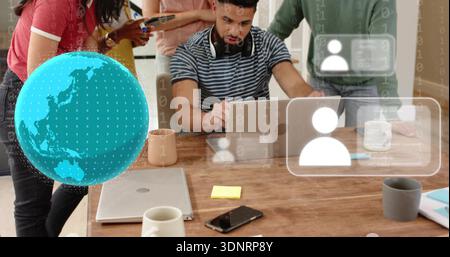 Working bearded man in striped tee headphones typing on laptop at office, wooden table AR overlays Stock Photo
