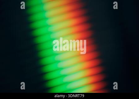 Abstract rainbow light refraction through ribbed glass, modern gradient background Stock Photo