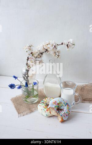 Donut with Sprinkles and Milk, Minimal Breakfast Still Life Stock Photo