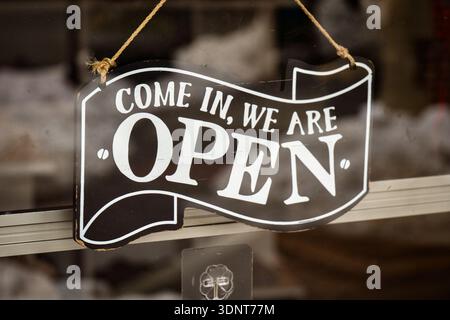 “We Are Open” sign displayed in the window of Casa 401 clothing store in Easton, Pennsylvania, photographed on February 11, 2026. Stock Photo