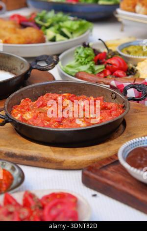 turkish menemen served at a meal with various dishes on the table Stock Photo