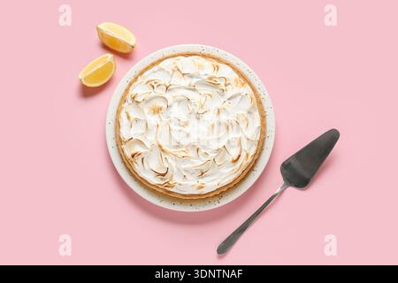 Plate with delicious lemon pie on pink table Stock Photo