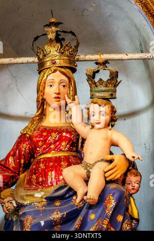 statue of Holy Mother with Baby Jesus. vertical shot. Stock Photo