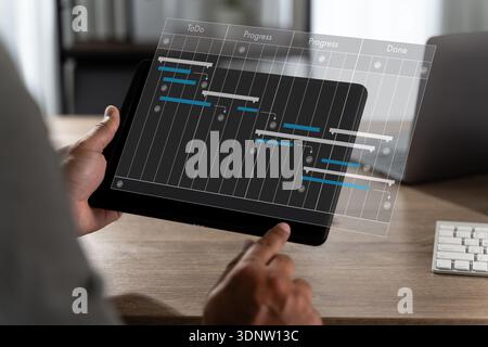 Project planning concept with timeline bars and progress columns manager reviews tasks, deadlines, and workflow status project management dashboard Stock Photo