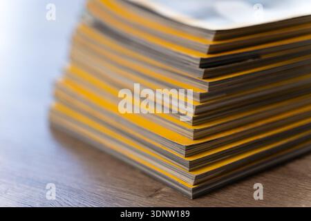 Close up stack file folders and documents office desk, representing paperwork backlog, records management, compliance filing workload document organiz Stock Photo