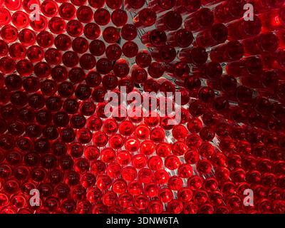 Numerous glowing red glass bottles form an intricate, textured visual from a bottom-up perspective, perfect for wine, beverage, or luxury branding bac Stock Photo