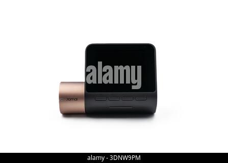 Compact dash cam with a white background. A professional device for driver safety and recording road incidents. Stock Photo
