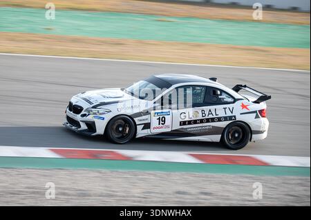 White and black BMW M2 CS Racing number 19 driven by Smorg and Macias competing on track during the GT-CER endurance championship at Circuit de Barcel Stock Photo