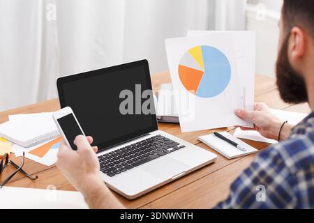Young casual businessman in office, close up Stock Photo